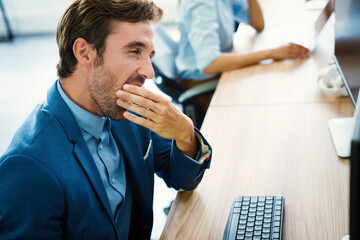 Wall Mural - Overworked tired employee at workplace in office being unhappy