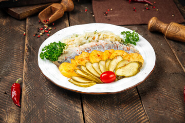 Wall Mural - Russian appetizer with herring potato and pickles