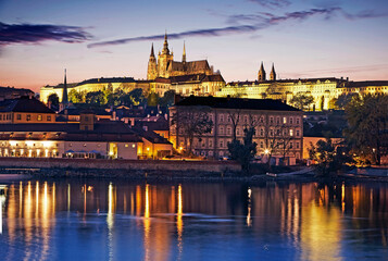 Wall Mural - Skyline of Prague overlooking the  illuminated at dusk