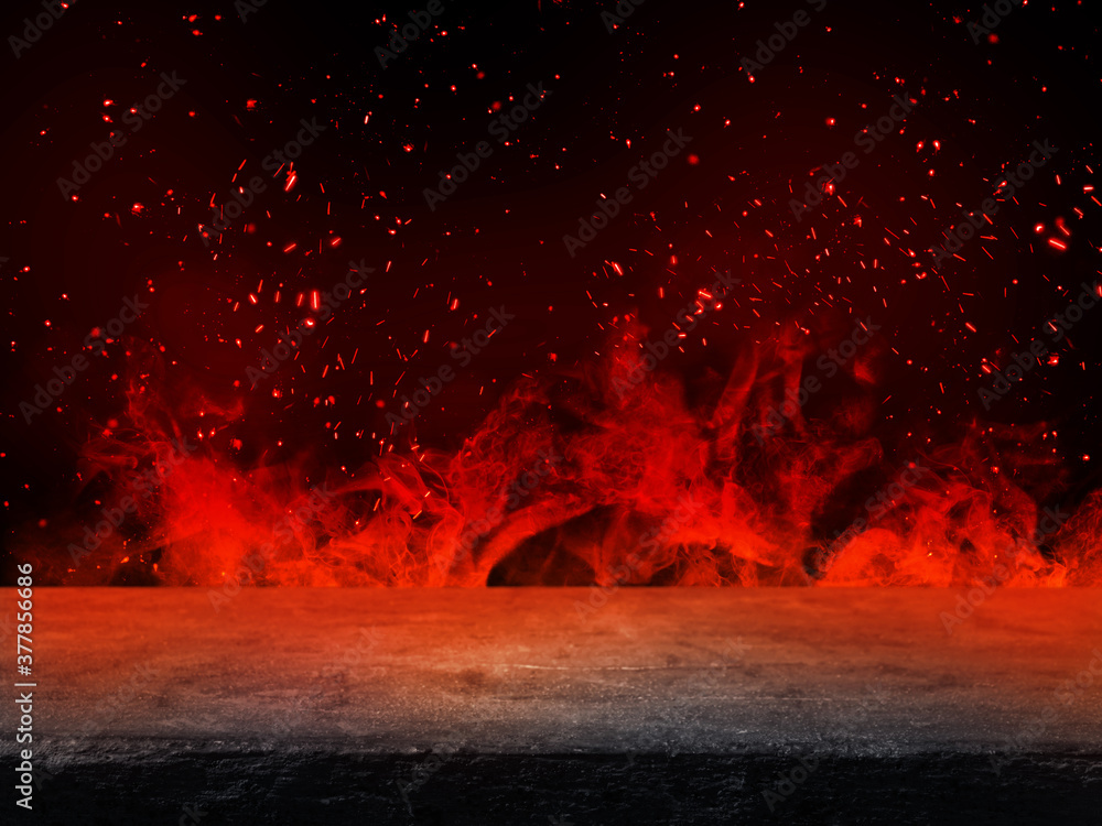 Side view of Empty stone table top with orange fire or flame and sparkles in dark room. - obrazy, fototapety, plakaty 
