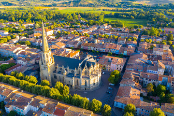 Scenic aerial view of French commune of Mirepoix in green valley at sunny summer day