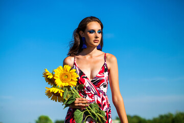 Close up portrait of a young beautiful girl in summer park