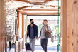 © Emma - Couple in masks visiting hotel during pandemic
