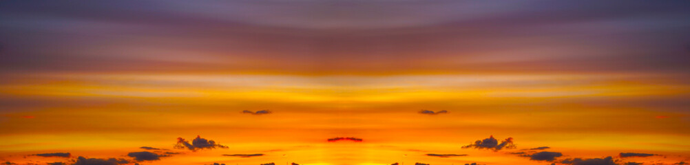 Wall Mural - blue sky with clouds at sunset. panorama. bright orange golden sunset. colorful evening sky backgrou