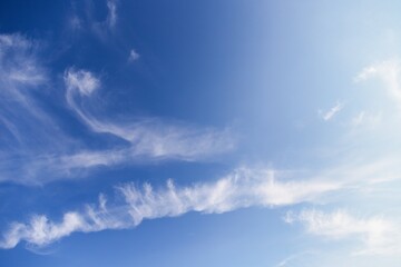 Wall Mural - White cirrocumulus clouds in the blue sky. Beautiful sky background