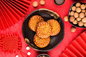 Poster - Mid-Autumn Festival concept, Traditional mooncakes on table  with teacup.