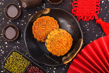 Poster - Mid-Autumn Festival concept, Traditional mooncakes on table  with teacup.