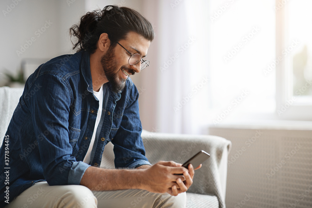 Honeguy Using Internet New Mobile App. Stylish Western Guy Using Smatphone At Home, Browsing ...