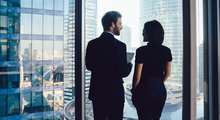 Wall Mural - Successful creative business people against window in downtown office