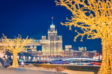 Wall Mural - Festive Moscow. Christmas in the capital of Russia. Christmas illumination in the center of Moscow. Trees with garlands on the background of snow. Holiday decorations in the Russian capital. New year