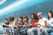© Alessandro Biascioli - Happy friends using mobile smartphone in underground station - Young people having fun with new trends social media apps - Youth millennial generation lifestyle and technology addiction concept