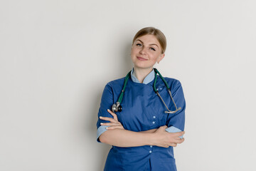 Smiling medical doctor woman with stethoscope. Isolated over white background