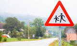 Fototapeta Miasto - traffic signs, warning that it is close to schools, and the possibility of having children on the road, adjust the speed to the conditions on the road