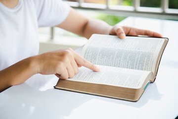 Wall Mural - Woman and bible Religious concept.