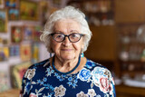 Fototapeta  - Portrait of an elderly woman at her home
