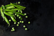 green peas on a black background