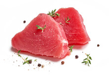Two Slice Of Raw Tuna Meat With Thyme Herbs And Spices Isolated On White Background.