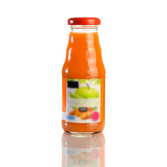 Wall Mural - Juice in a glass bottle, bright colored drink on a white background isolated