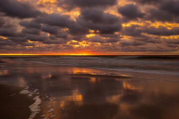 Wall Mural - sea landscape at sunset. beach, sea waves, breakwaters.