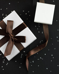 Two white jewelry boxes one with box and one with empty space for logo