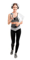 Wall Mural - Sporty young woman with bottle of water on white background