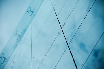 Sticker - Front view of sky and cloud reflection on modern office building glass wall and windows