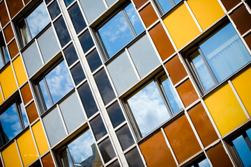 Wall Mural - Low angle shot of colorful block of flats