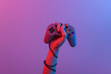 Hands Holding Retro Joystick In Blue-red Neon Gradient Light. Old Gaming. 80s Retro Wave. Minimalism
