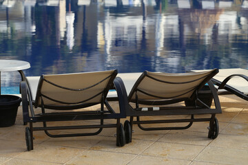 Back view of deck chairs near the pool