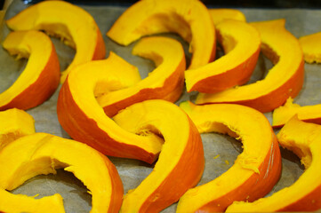 Poster - Closeup shot of fresh pumpkin slices on a tray