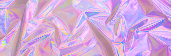 Fototapete - Blurred soft focused abstract trendy rainbow holographic banner background in 80s style. Textile texture in violet, pink and mint soft pastel colors.