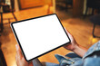 © Farknot Architect - Mockup image of a woman holding digital tablet with blank white desktop screen