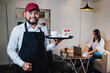© Marcos - Small business happy owner of a coffee cafe in Latin America