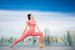 © anekoho - Asian beautiful woman in pink sports uniform doing a yoga exercise