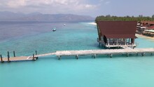 Aerial Dolly Flight Showing Colorful Landscape Of Luxury Gili Island And Empty Boat Houseduring Covid19 Pandemic On Earth.