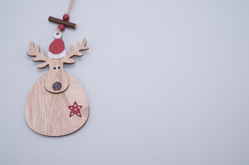 Canvas Print - Closeup shot of a deer-shaped wooden Christmas ornament isolated on a white background