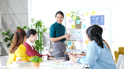Wall Mural - brainstorm planing creative asian teamwork, group of asia mobile phone app developer team meeting fo