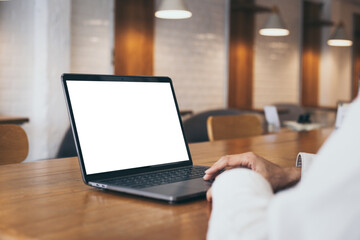 computer mockup blank screen.hand woman work using laptop with white background for advertising,contact business search information on desk at coffee shop.marketing and creative design