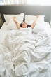 © Viacheslav Yakobchuk - Female stretching herself after waking up in the morning