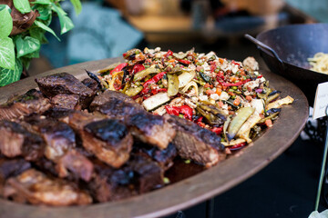 Wall Mural - grilled vegetables and chicken on platter at buffet table for event