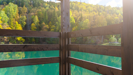 Wall Mural - Blue mountain lake with a house. Beautiful autumn morning