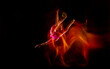© master1305 - Fireball. Young flexible girl isolated on black studio background in mixed light. Female rhythmic gymnastics artist practicing in action. Exercises for flexibility, balance. Grace in motion, sport.