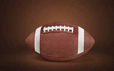 Wall Mural - American football ball on brown background