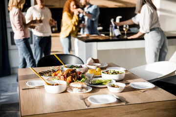 Wall Mural - Beautiful served table with food in a cozy home