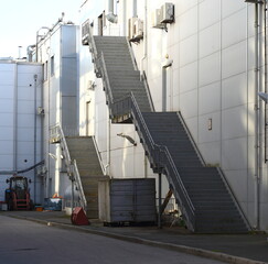 Stairs to the second floor on the outside of the wall