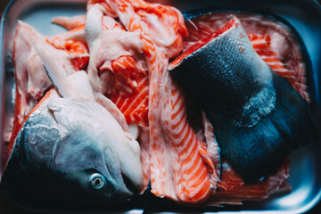 Raw cut salmon: head, bone, tail