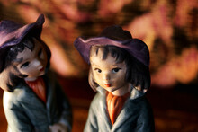 Closeup Of Vintage Porcelain Statuettes Of Two Boys In Berets