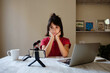 © ZHPH Production by Artem Zhushman/Stocksy - Podcast streaming young woman work from home
