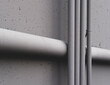 © Rialto Images/Stocksy - Electrical piping and drainage pipe on building wall