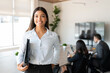 Leinwandbild Motiv Hispanic female business professional in office boardroom